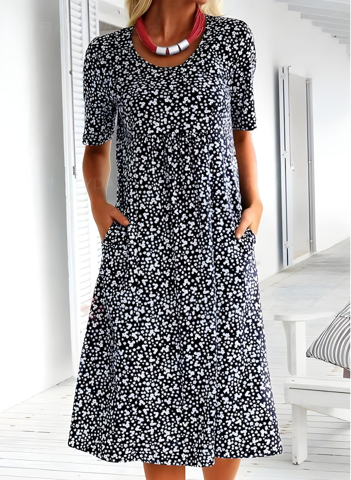 Lekka letnia sukienka Sophie, elegancka z oddychającego materiału, nowoczesny design, idealna na niezobowiązujące letnie wyjścia.