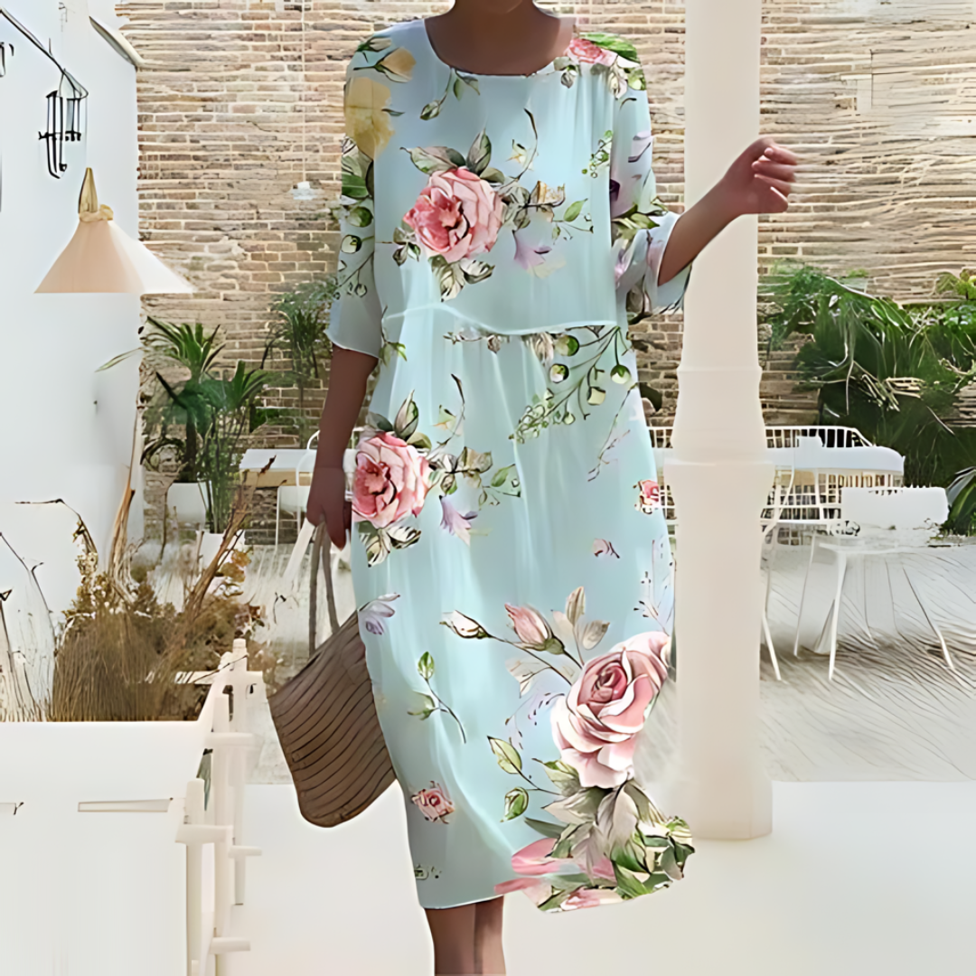 Zwiewna i elegancka letnia sukienka midi, idealna na słoneczne dni, wykonana z lekkiego materiału zapewniającego komfort i swobodny styl.