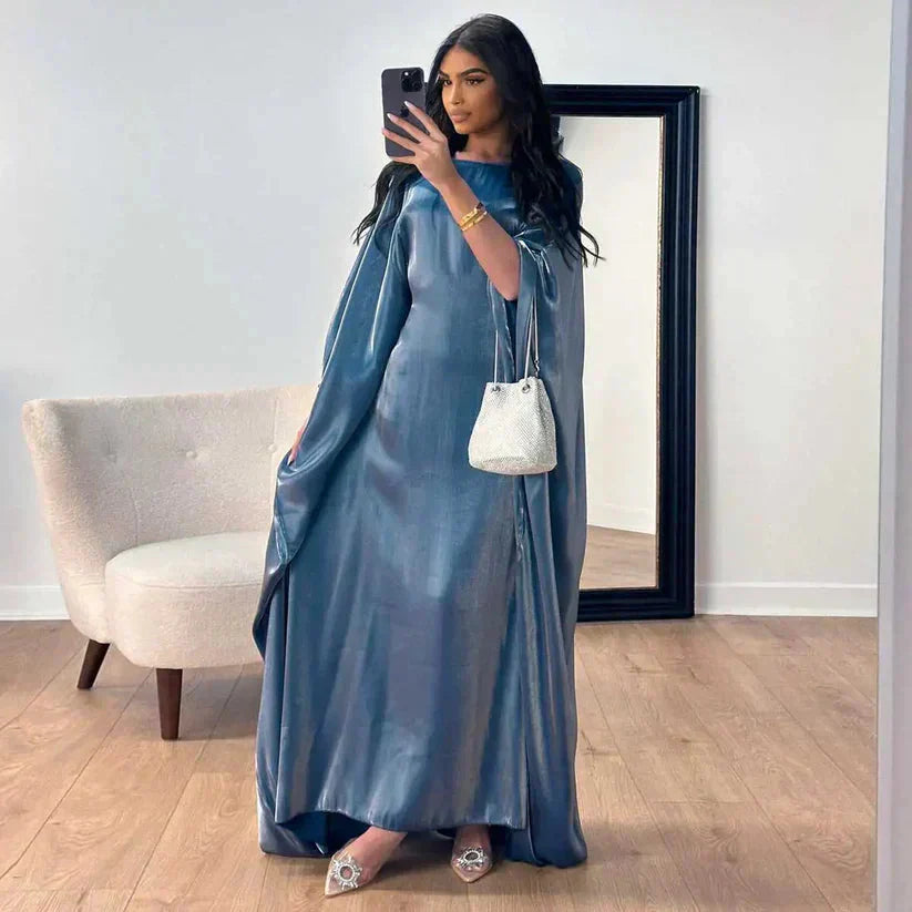 Płynna długa sukienka Abaya Alina, z długimi rękawami, wykonana z miękkiego materiału, z wyrafinowanymi detalami na specjalne okazje.