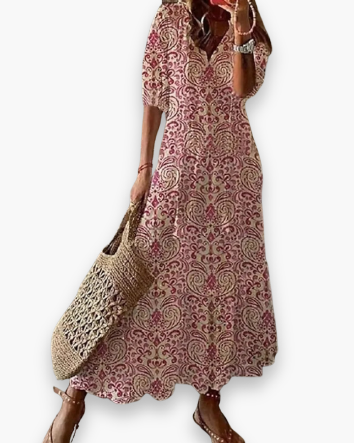 Długa damska sukienka boho, kwiatowy nadruk, elegancka i zwiewna na lato, luźny krój, romantyczny swobodny styl.