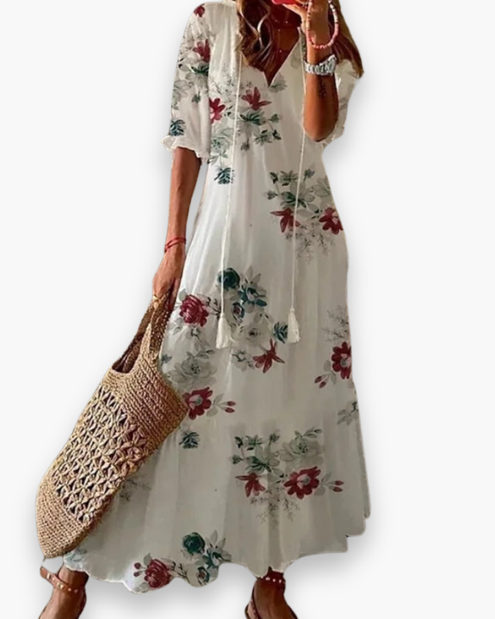 Długa damska sukienka boho, kwiatowy nadruk, elegancka i zwiewna na lato, luźny krój, romantyczny swobodny styl.