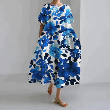 Długa luźna sukienka damska, różowy kwiatowy wzór, elegancki styl boho, miękka bawełna, swobodny krój.