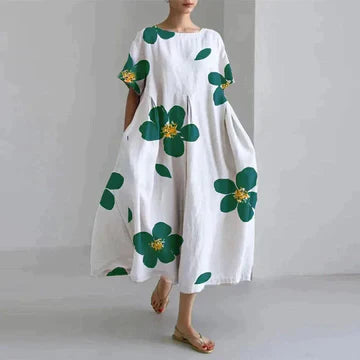 Długa luźna sukienka damska, różowy kwiatowy wzór, elegancki styl boho, miękka bawełna, swobodny krój.