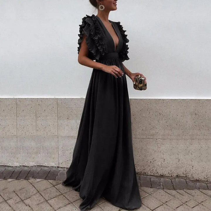 Elegancka sukienka maxi damska z falbankami i głębokim dekoltem, idealna na letnie wieczory i specjalne okazje.