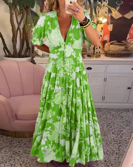 Rozkloszowana sukienka maxi z dekoltem w serek, żywym wzorem kwiatowym, bufiastymi rękawami, szykowny i elegancki styl dla kobiet