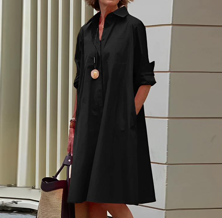 Elegancka letnia sukienka midi z lekkiej tkaniny, dopasowany krój, żywy kolor, idealna na komfort i styl.