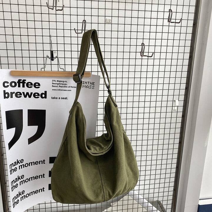Pojemna torba na ramię z płótna, minimalistyczny design, regulowany pasek, idealna do pracy i na co dzień.