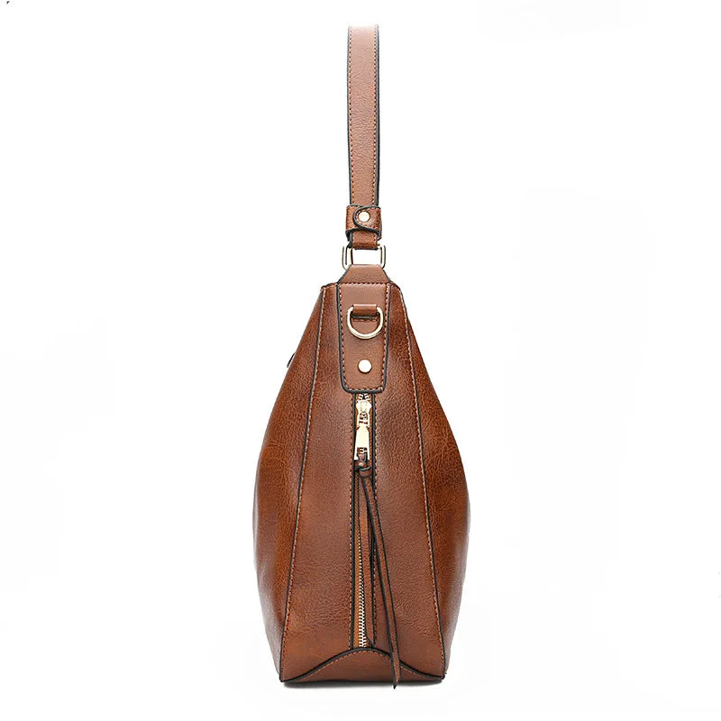 Damska torebka Hobo z miękkiego materiału, przestronna i elegancka.