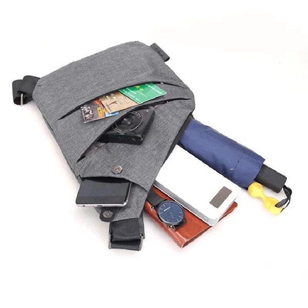 Antykradzieżowa torba na ramię dla mężczyzn, ergonomiczny design, wodoodporny materiał, liczne przegródki, stylowy kolor.
