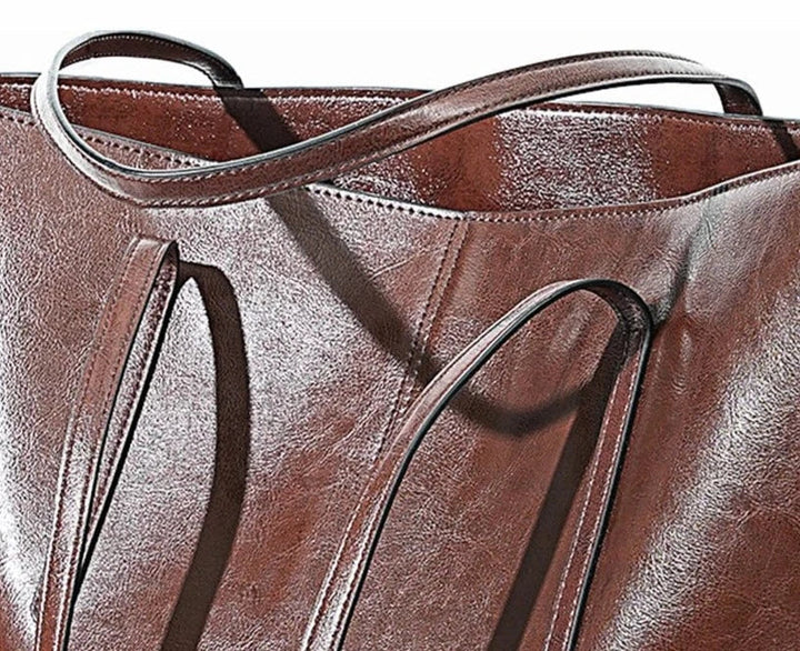 Brązowa damska torba na laptopa z prawdziwej skóry, nowoczesna, wytrzymała i elegancka, idealna do pracy lub na studia.