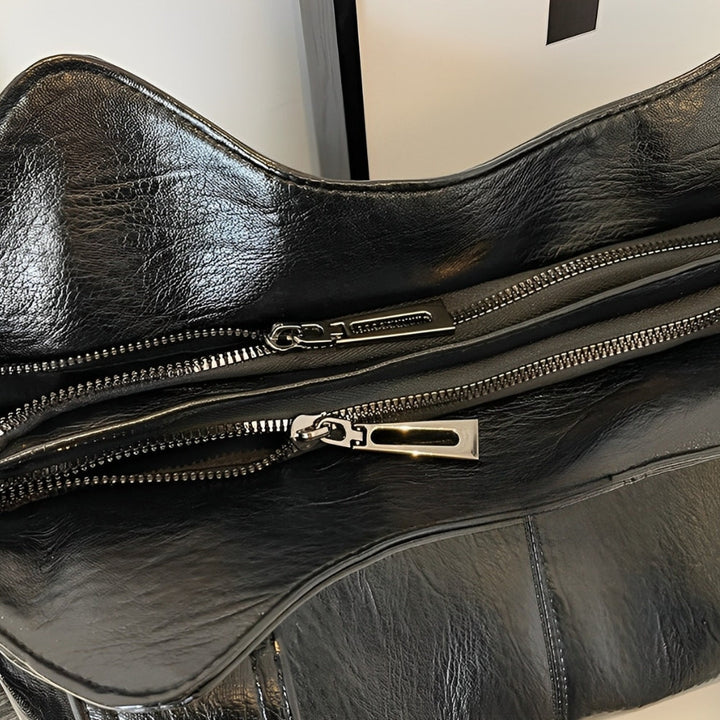 Torba damska na ramię ze skóry wegańskiej, o eleganckim designie, w klasycznym kolorze, idealna dla nowoczesnych kobiet.