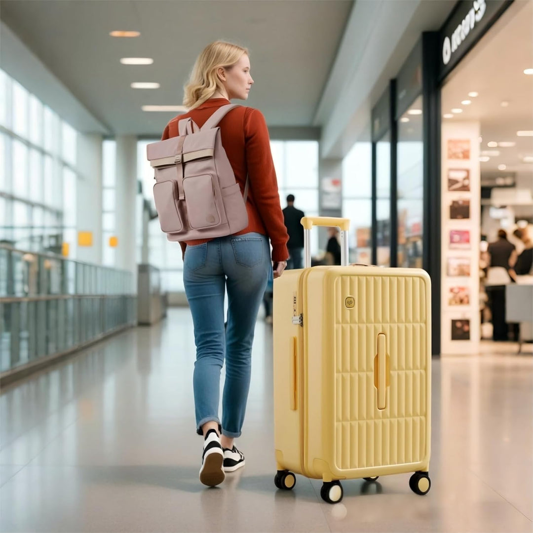 Żółta, duża walizka podróżna z twardą skorupą 26 cali, idealna na długie wyjazdy.