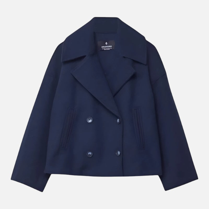 Minimalistyczna marynarka damska z taliowaniem, elegancka, szykowny krój, dwurzędowa, lejący materiał, szerokie klapy, nowoczesna.